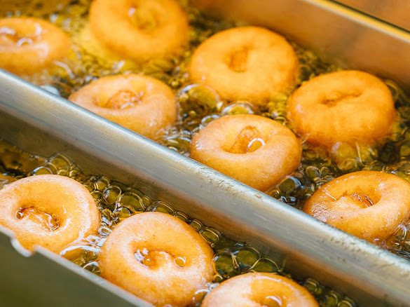 Mini donuts frying up close
