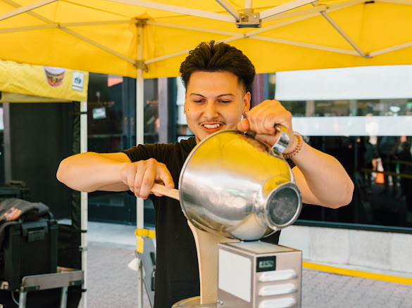 Founder pouring batter at the booth