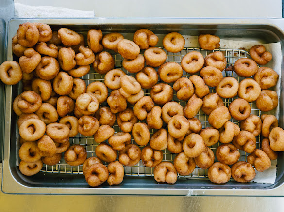 Fresh mini donuts on a rack